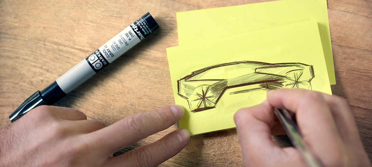 Skice BMW Vision iNEXT Ruky kreslia skice BMW Vision iNEXT na papierové samolepky